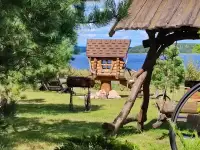 Дом-усадьба на берегу озера Струсто.