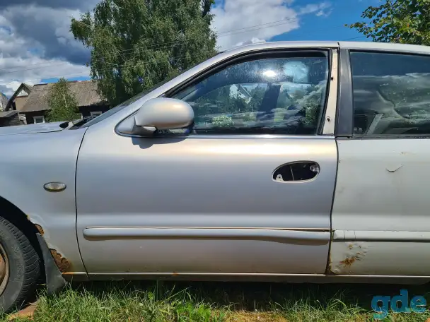 Водительская дверь Kia Clarus, фотография 1